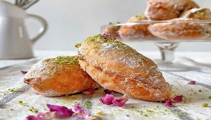 چرا خمیر قطاب من پس از سرخ شدن، سفت و خشک میشود و آن بافت ترد و پودری را ندارد؟